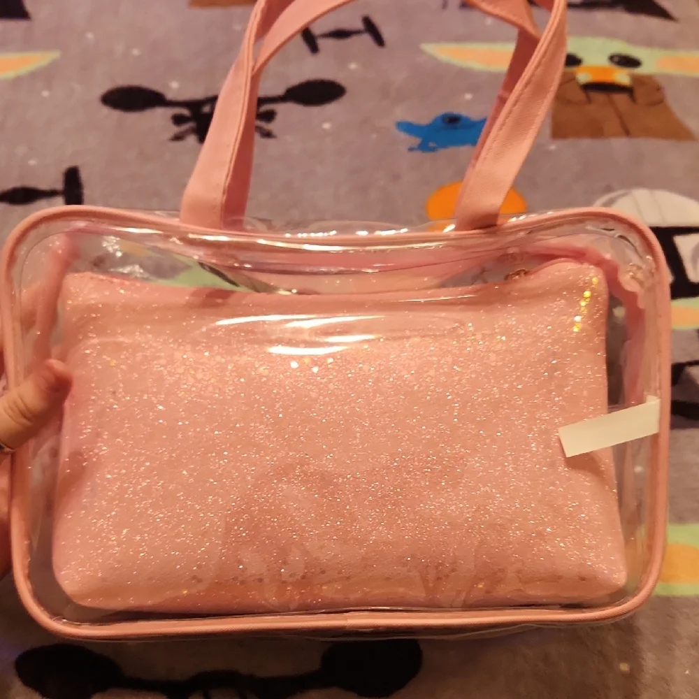 Pink Cosmetic Bag with Transparent Design and Top Handle